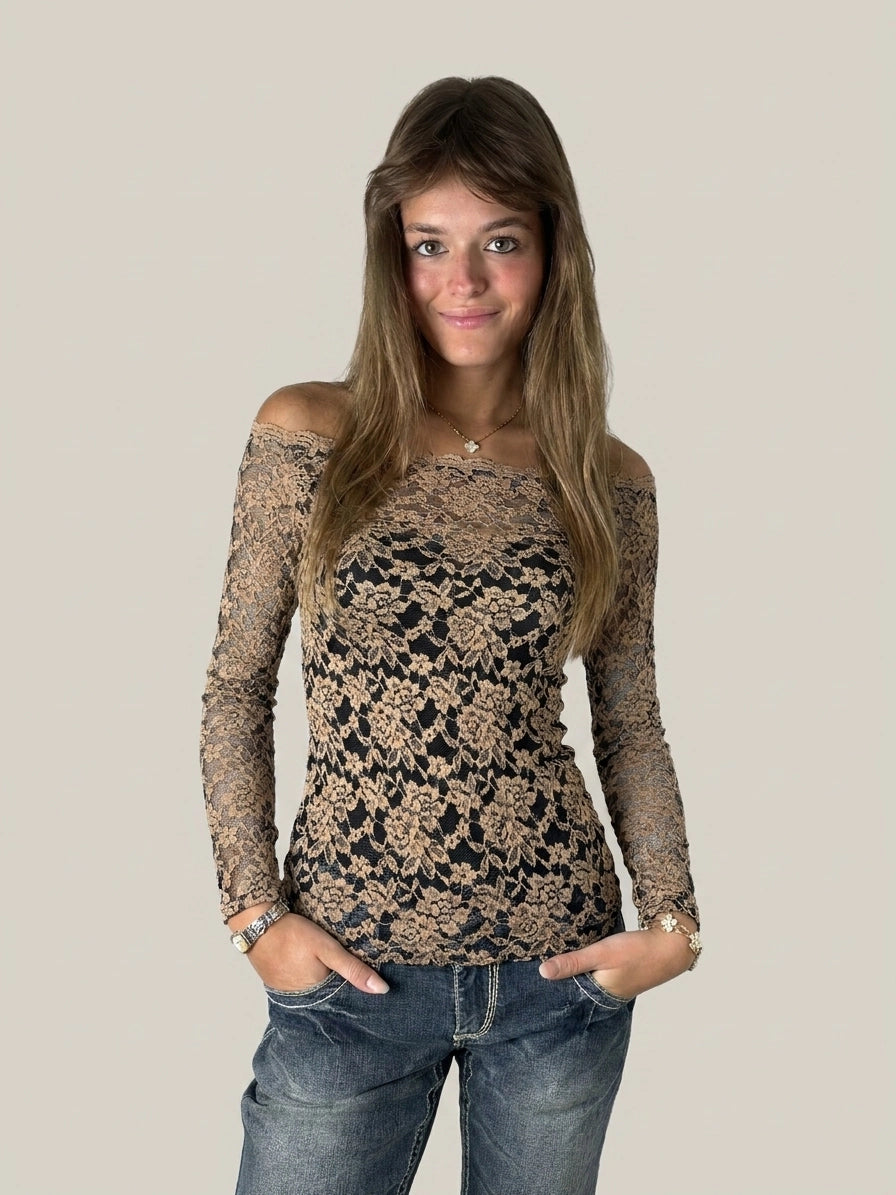 Front view of a black and beige floral lace bardot top.