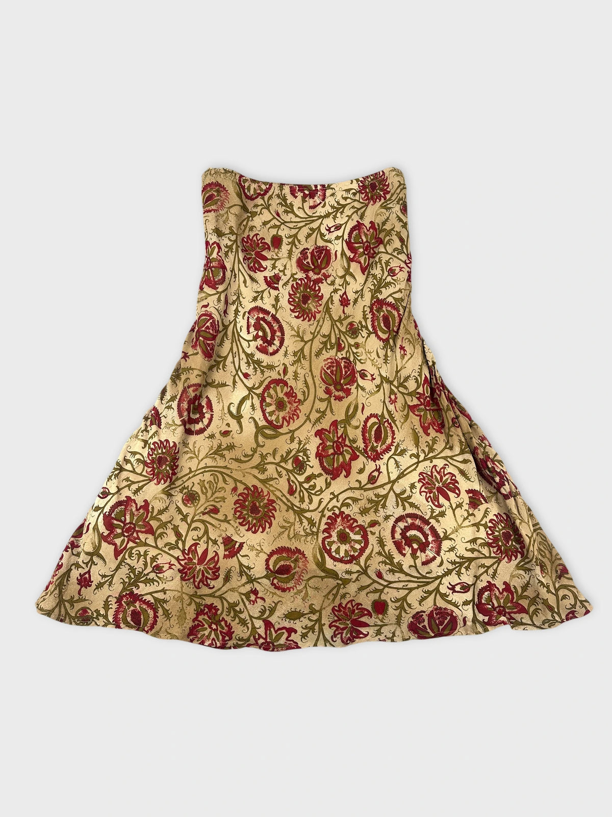 Floral maxi skirt in gold with red floral pattern back view.