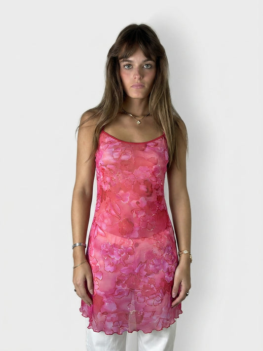 Floral sheer top in pink with adjustable straps, front view.
