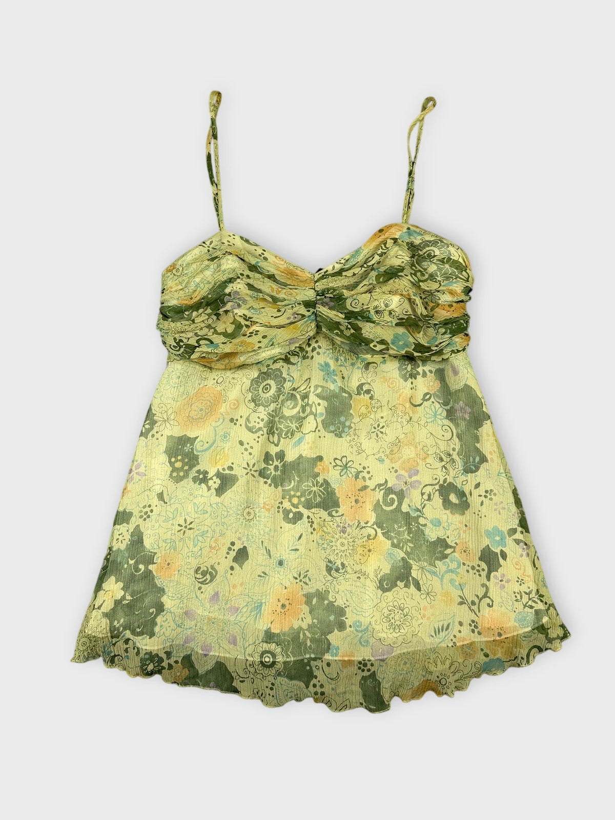 Floral silk cami top in green with ruffled trim front view.