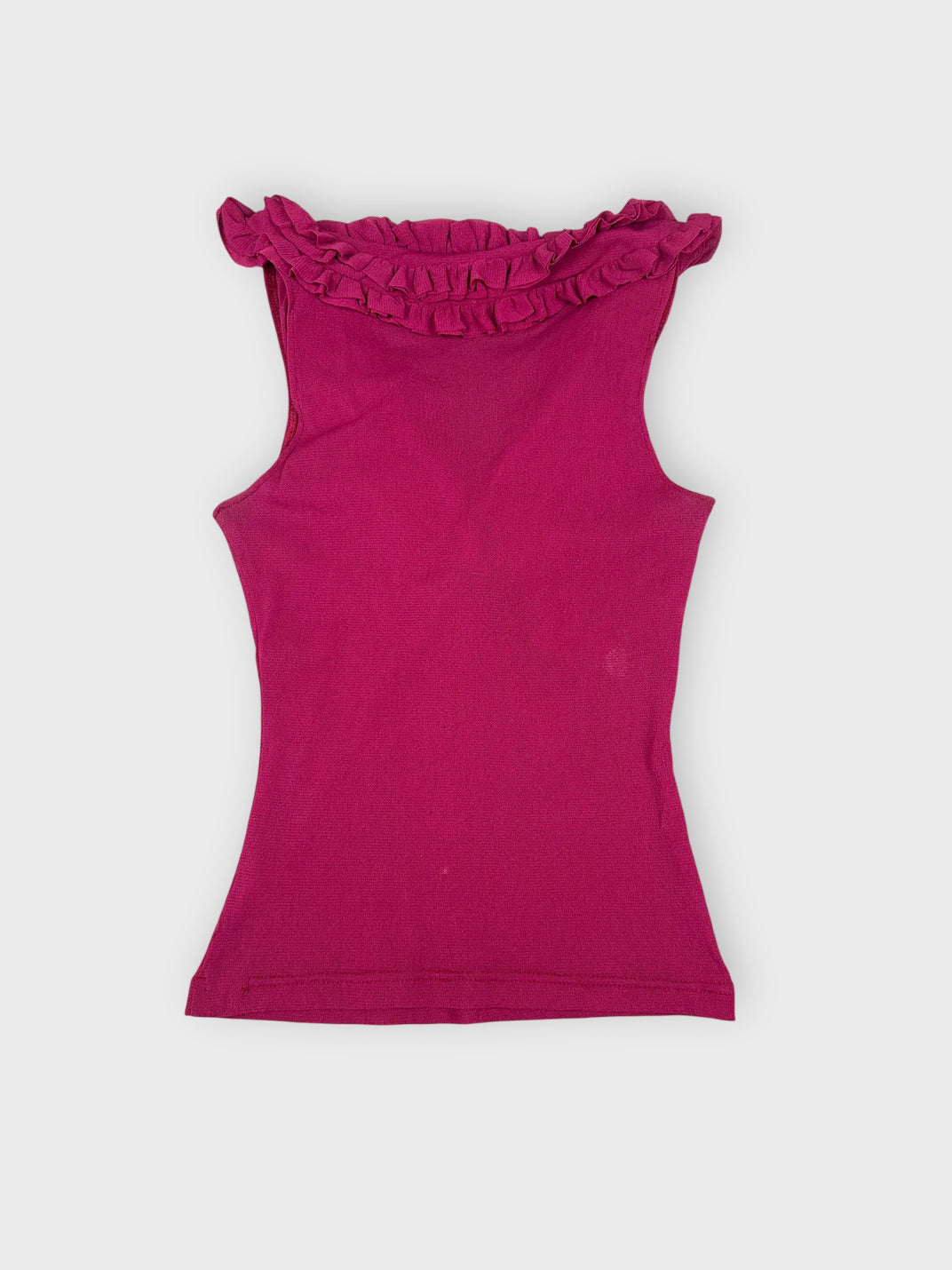 Fuchsia ruffled top back view showing a frilled neckline detail.