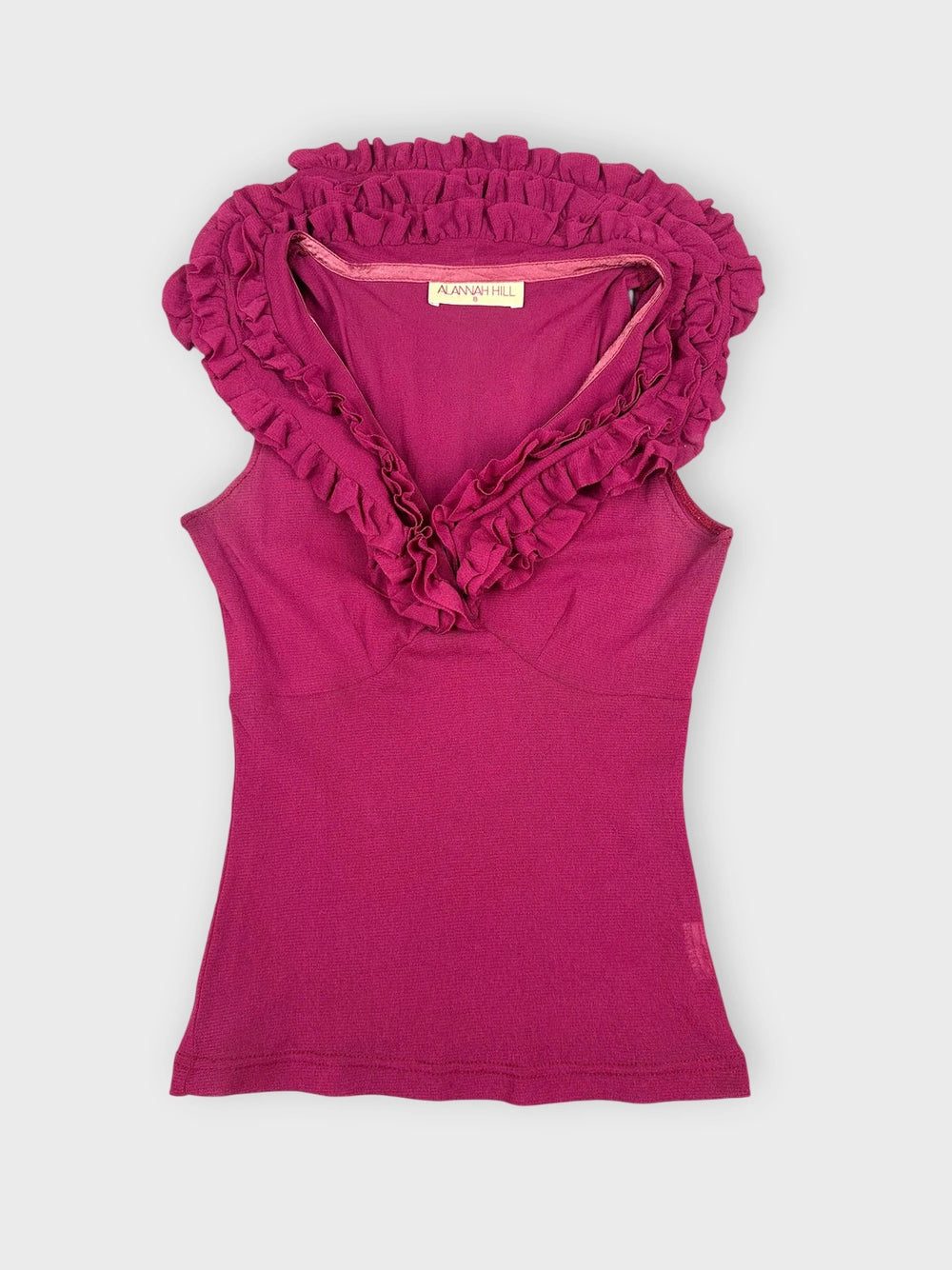 Fuchsia ruffled top with a V-neck front view.