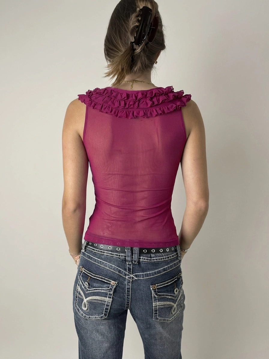 Fuchsia ruffled charmer top in back view, showcasing ruffled neckline detail.