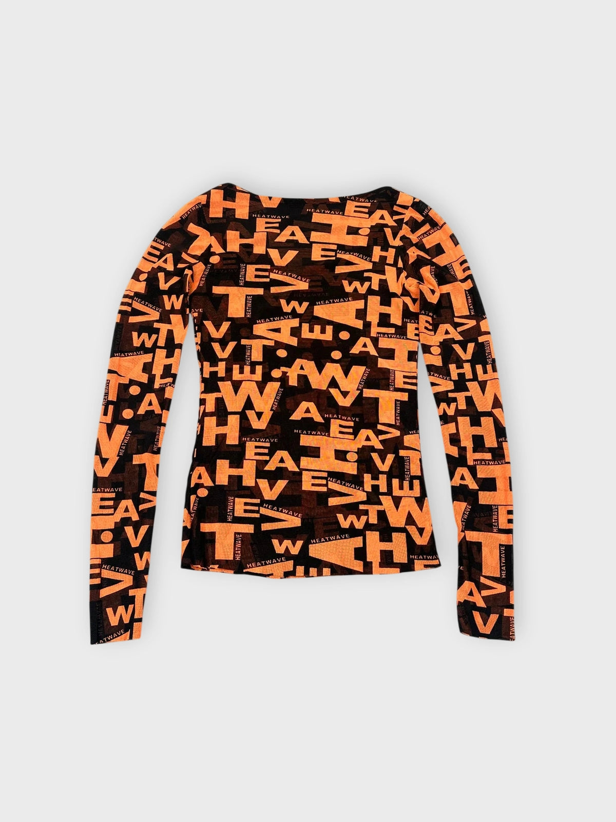 Graphic long sleeve top in bold orange with black print back view.