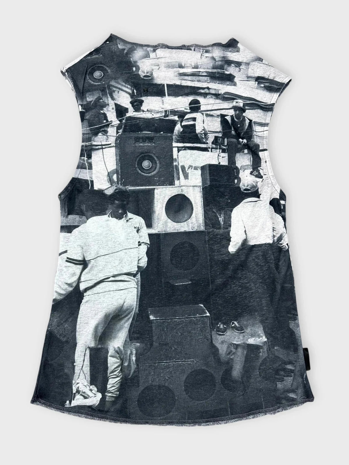 Back view of sleeveless black graphic print top featuring a vintage scene.