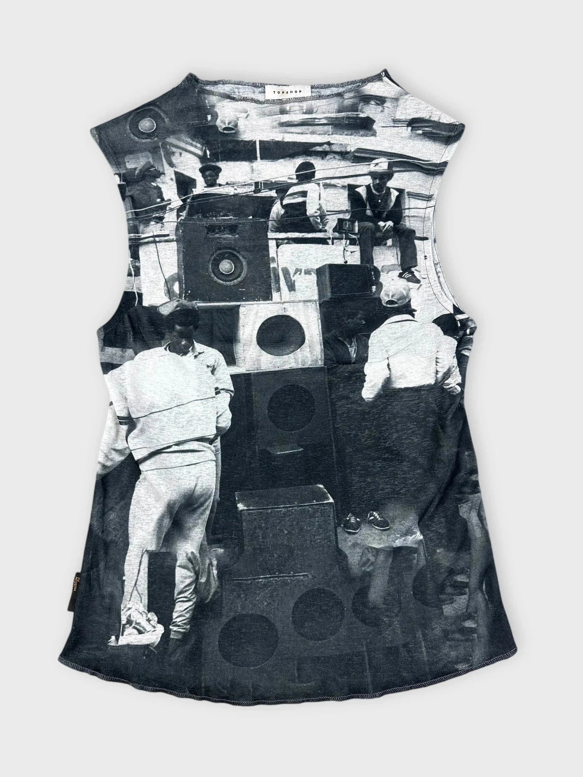Graphic sleeveless top in black with a vintage print detail, front view.
