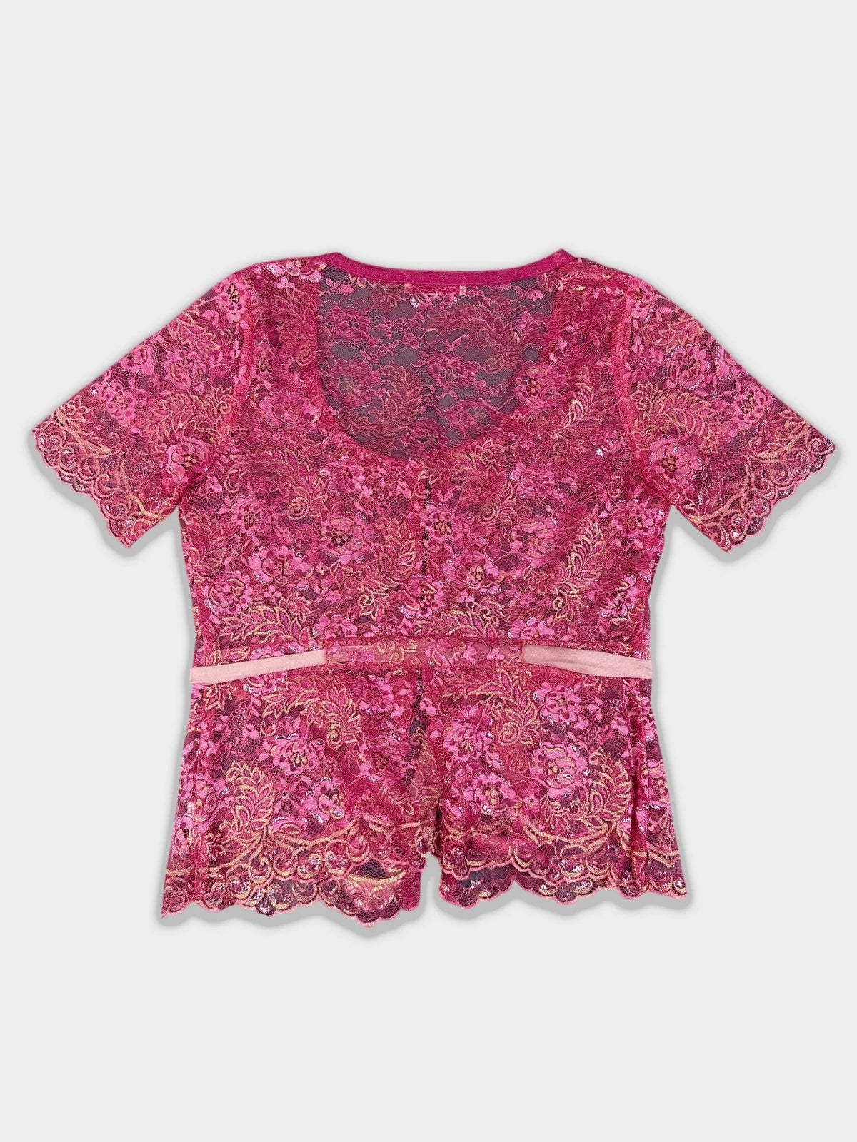 Back view of a pink lace button-up top featuring scalloped edges.