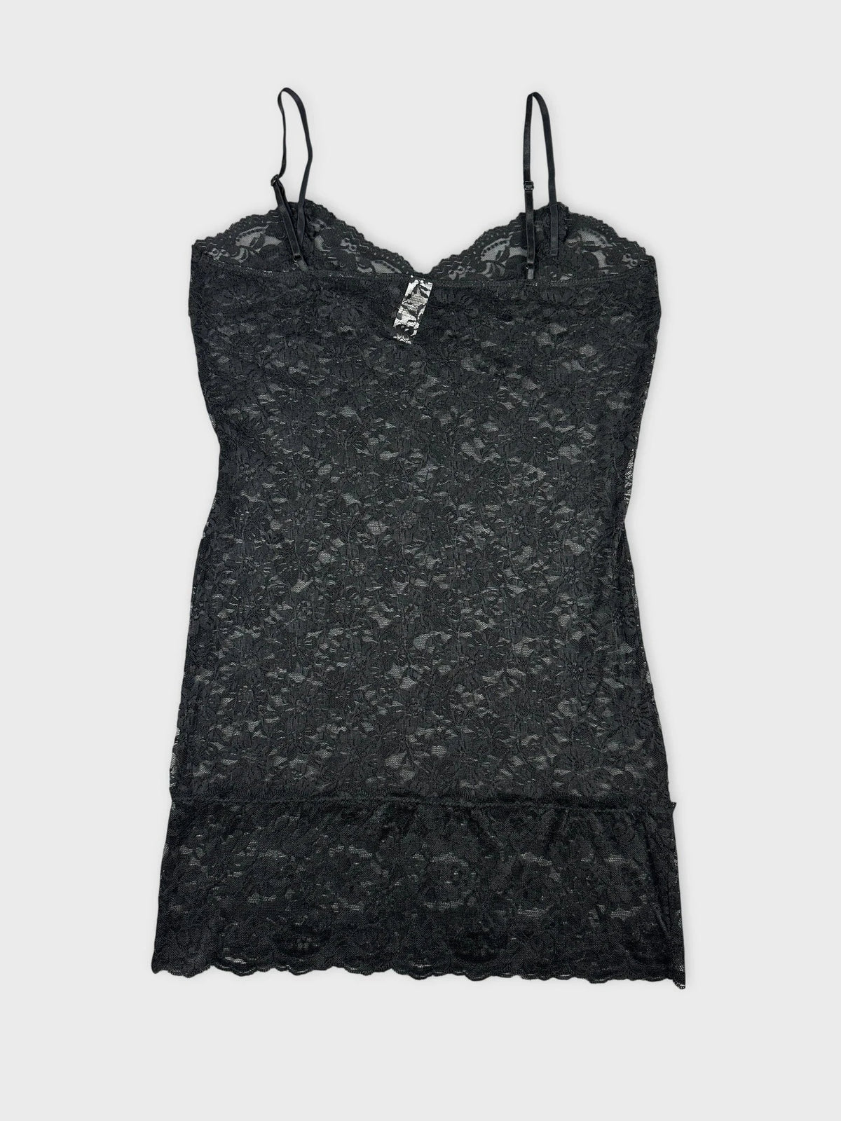 Lace cami top in black with floral pattern back view.