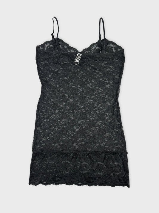 Lace cami top in black with floral pattern back view.