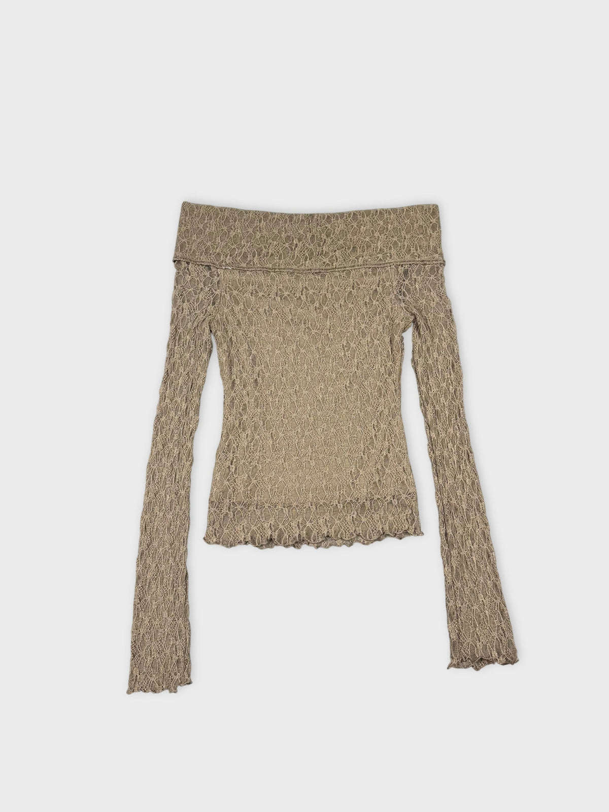 Back view of a lace long sleeve top in beige with sheer detail.