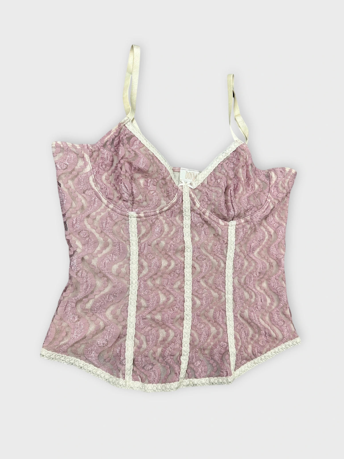 Lace pink crop top detail view featuring a sweetheart neckline and lace trim.