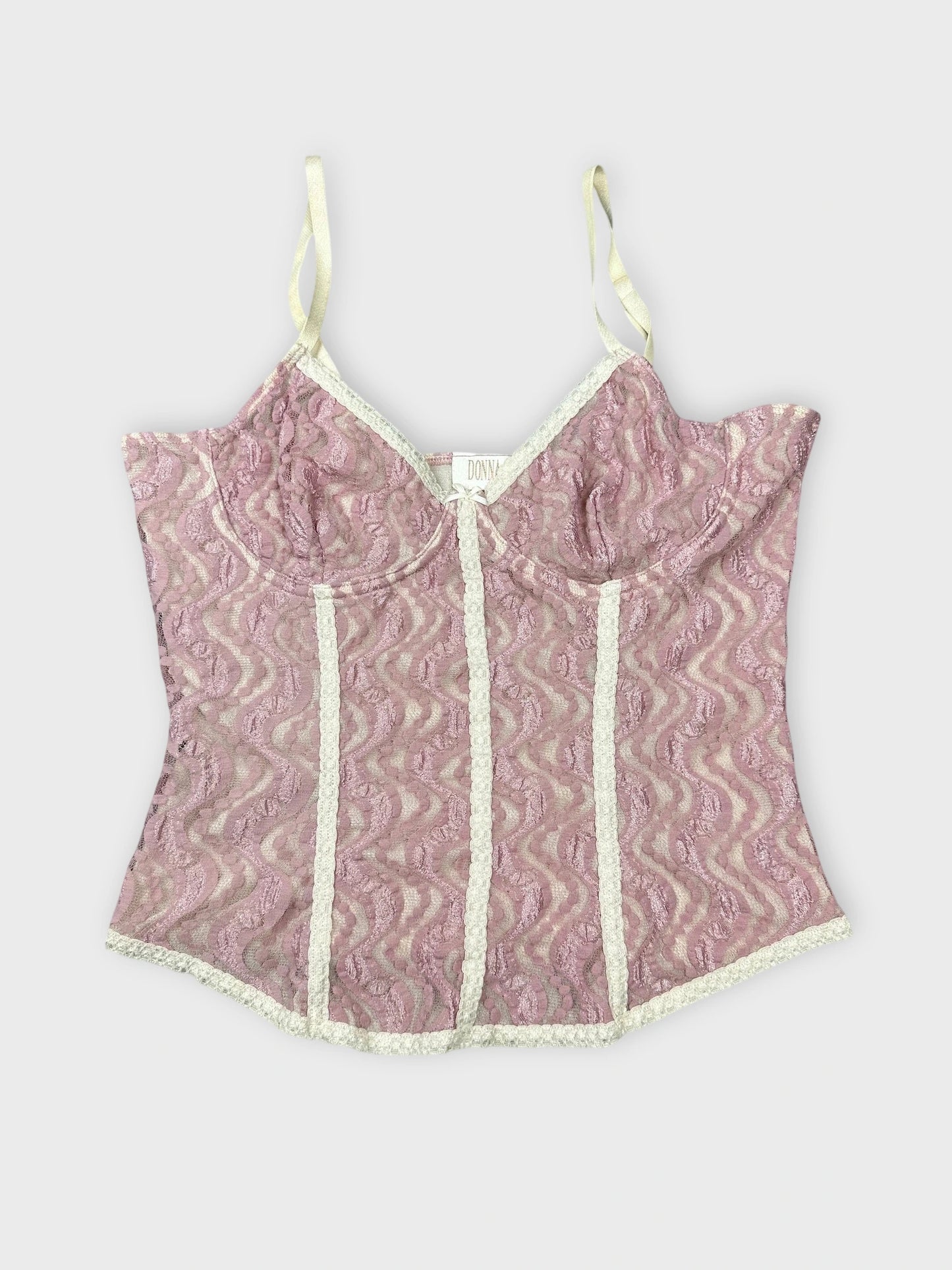 Front view of pink lace crop top with sweetheart neckline and wavy pattern.