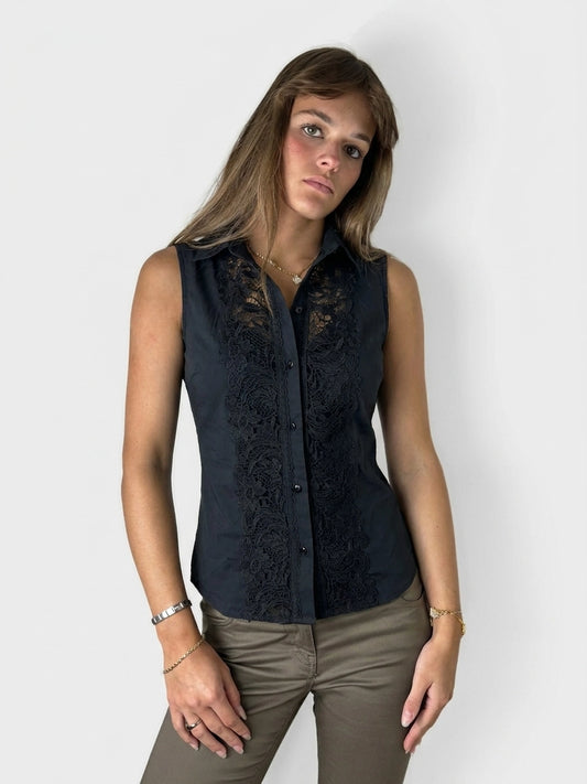 Front view of a black blouse featuring intricate lace detail.