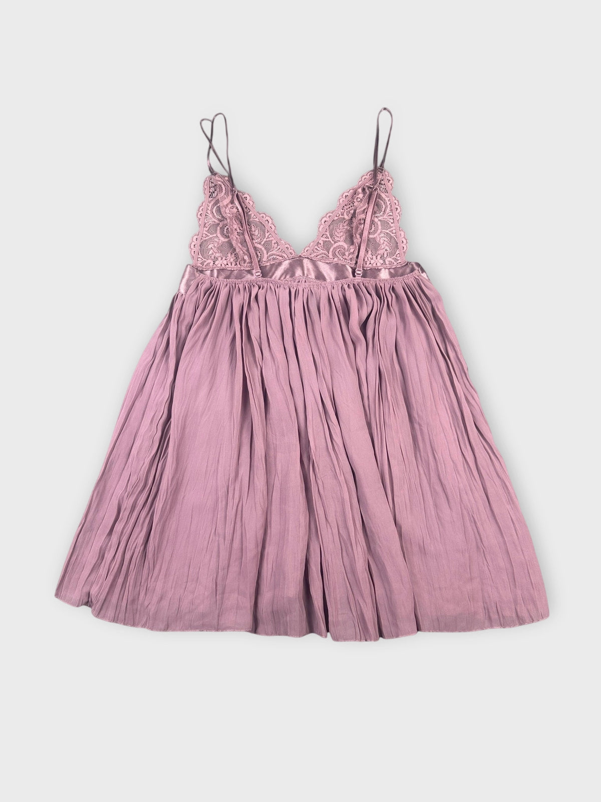 Back view of a lavender lace bralette featuring a pleated design.