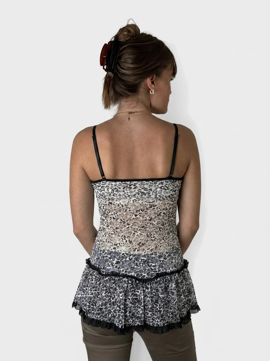 Back view of leopard print flare top with ruffles in neutral colors.