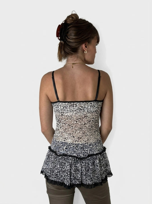Back view of leopard print flare top with ruffles in neutral colors.