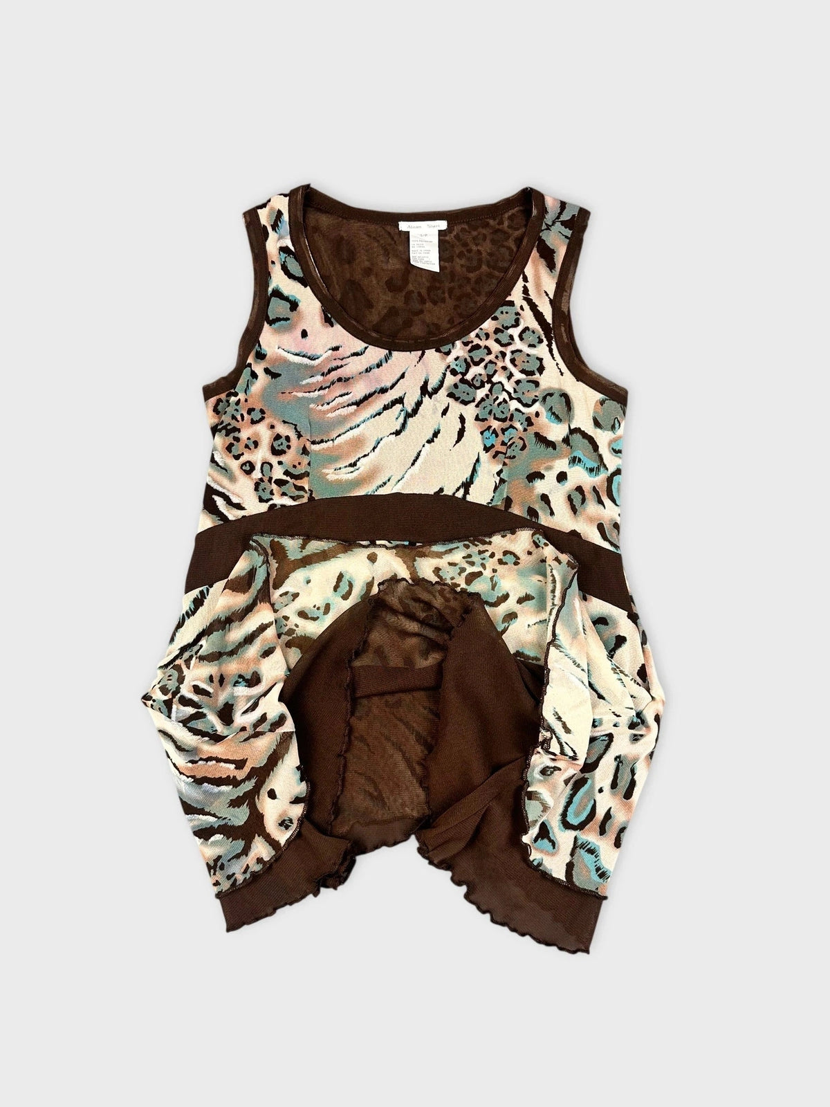 Detail view of a leopard print flare top in soft blue and beige tones.