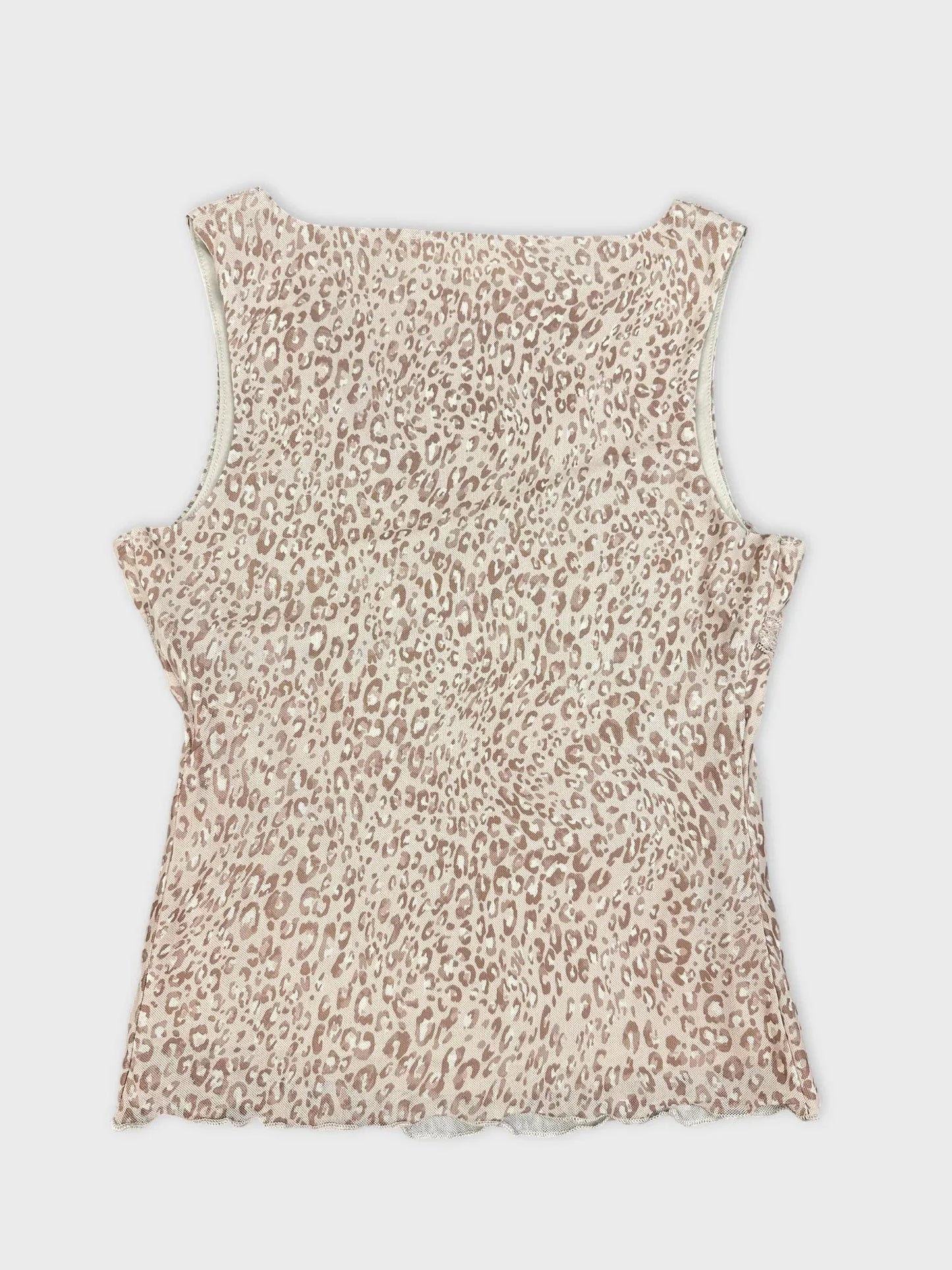 Detail view of a beige leopard print short sleeve top