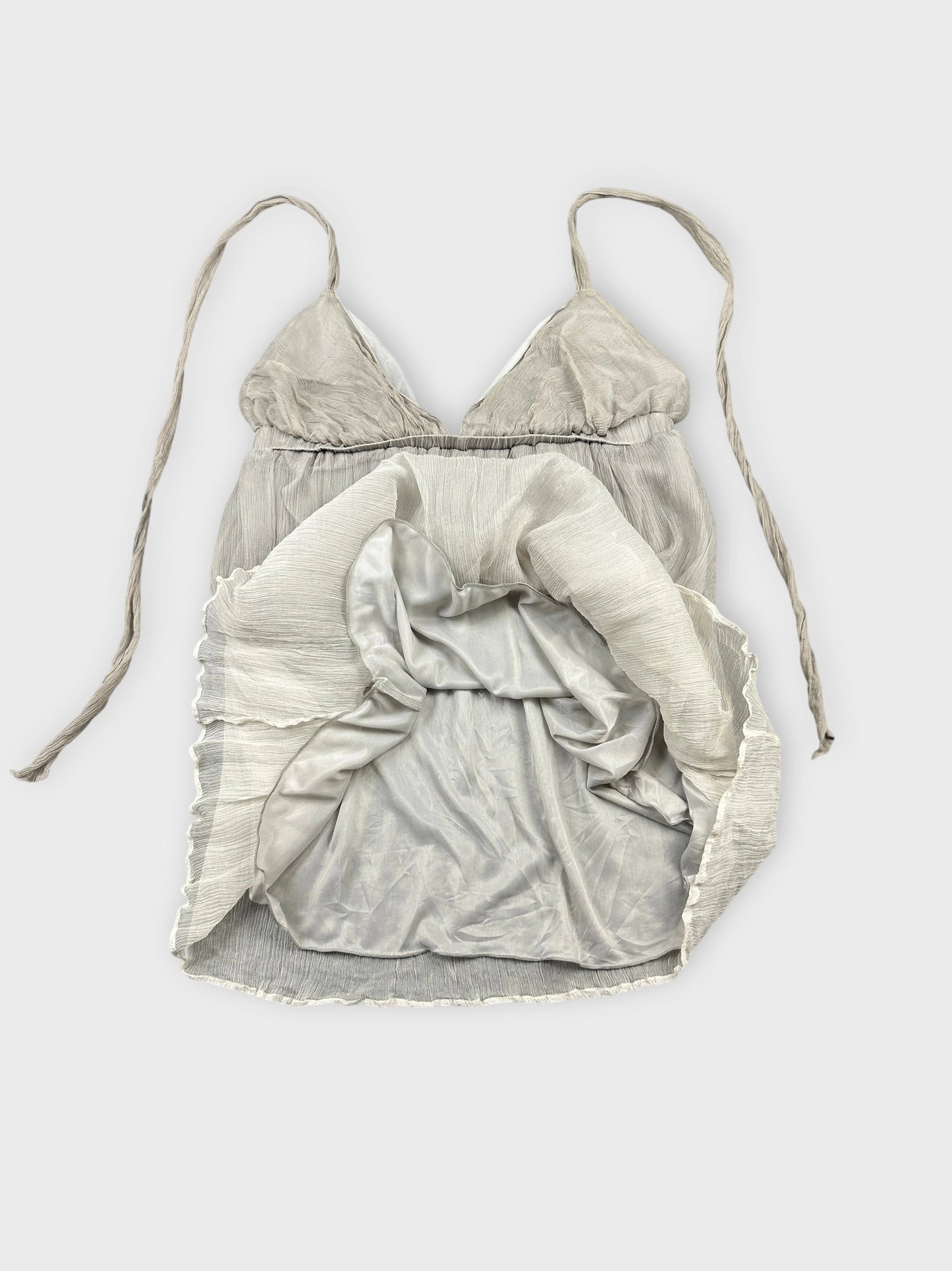 Light grey silk halter top with textured detail view and adjustable straps.