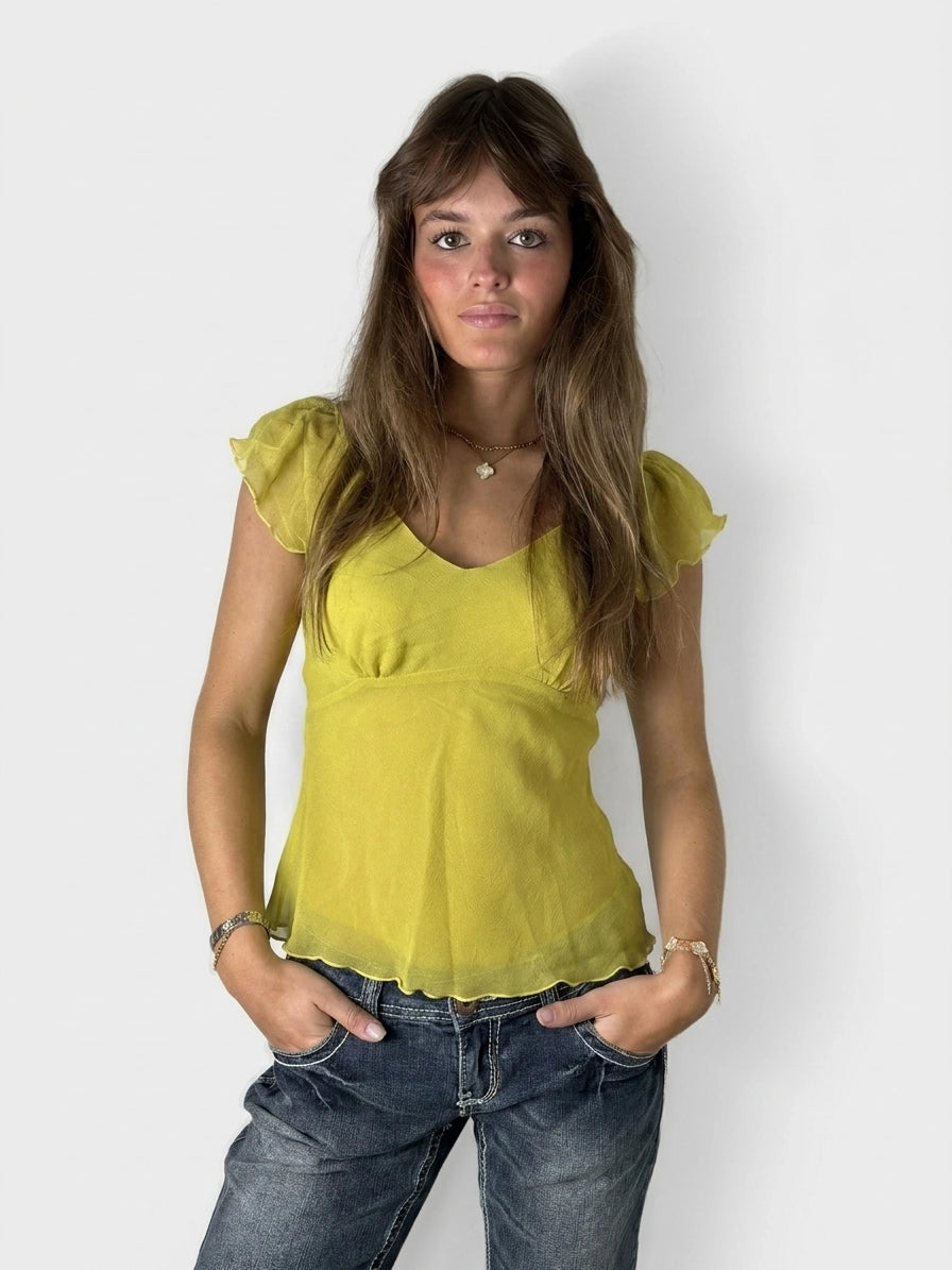 Lime puff sleeve top with scalloped hem, front view, featuring soft fabric and gentle ruffles.