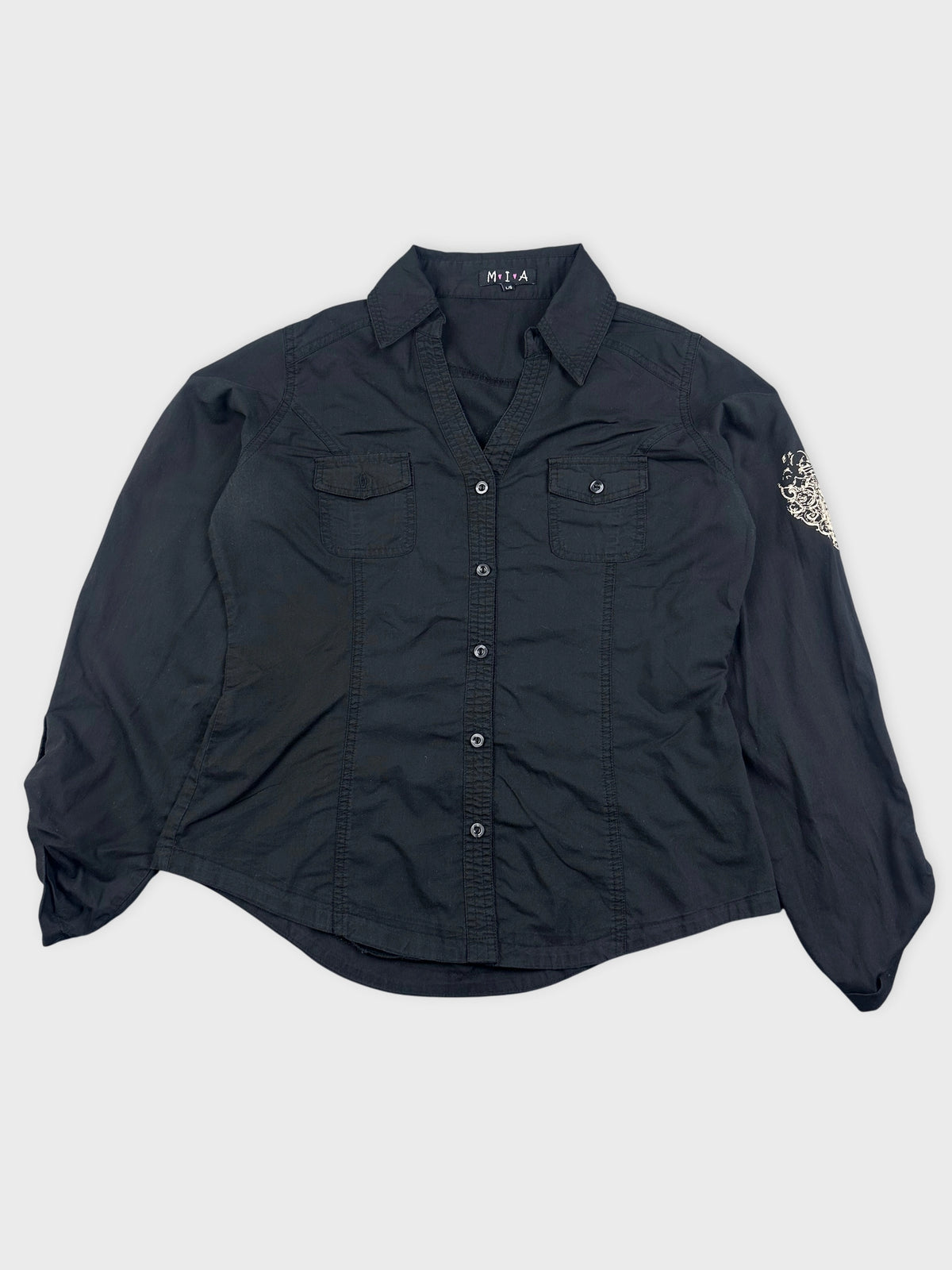 Front view of a long-sleeve black blouse with two chest pockets.