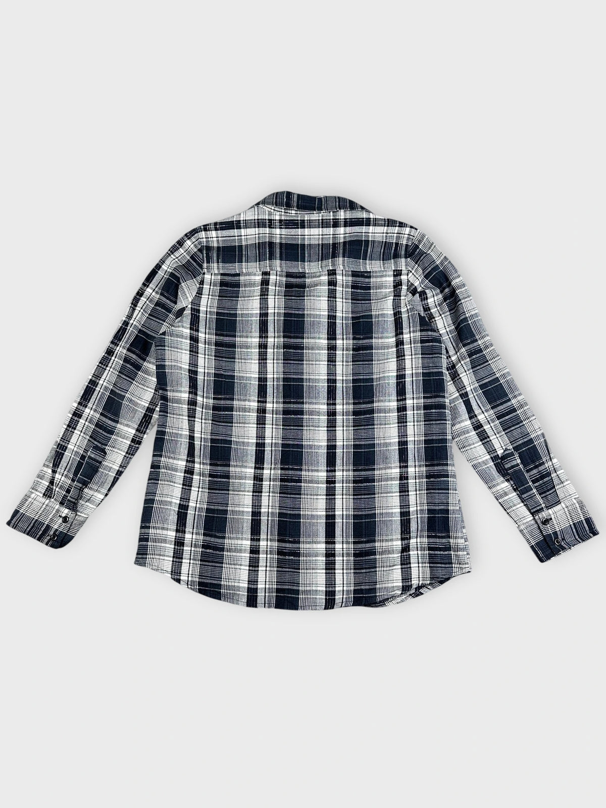 Back view of a plaid longsleeve top in navy and white.
