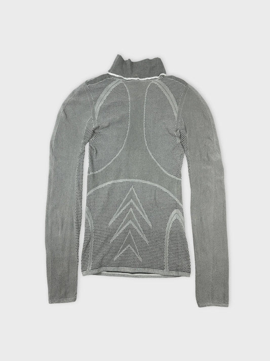 Front view of a gray mesh long sleeve top featuring geometric cutouts.