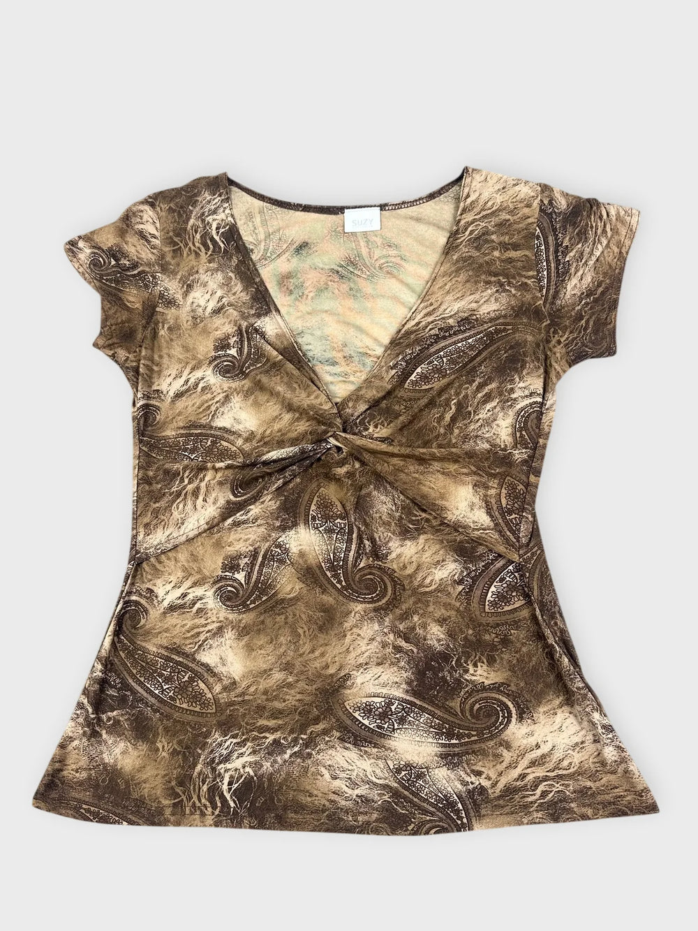 Front view of a brown mesh top with paisley pattern and twist detail.