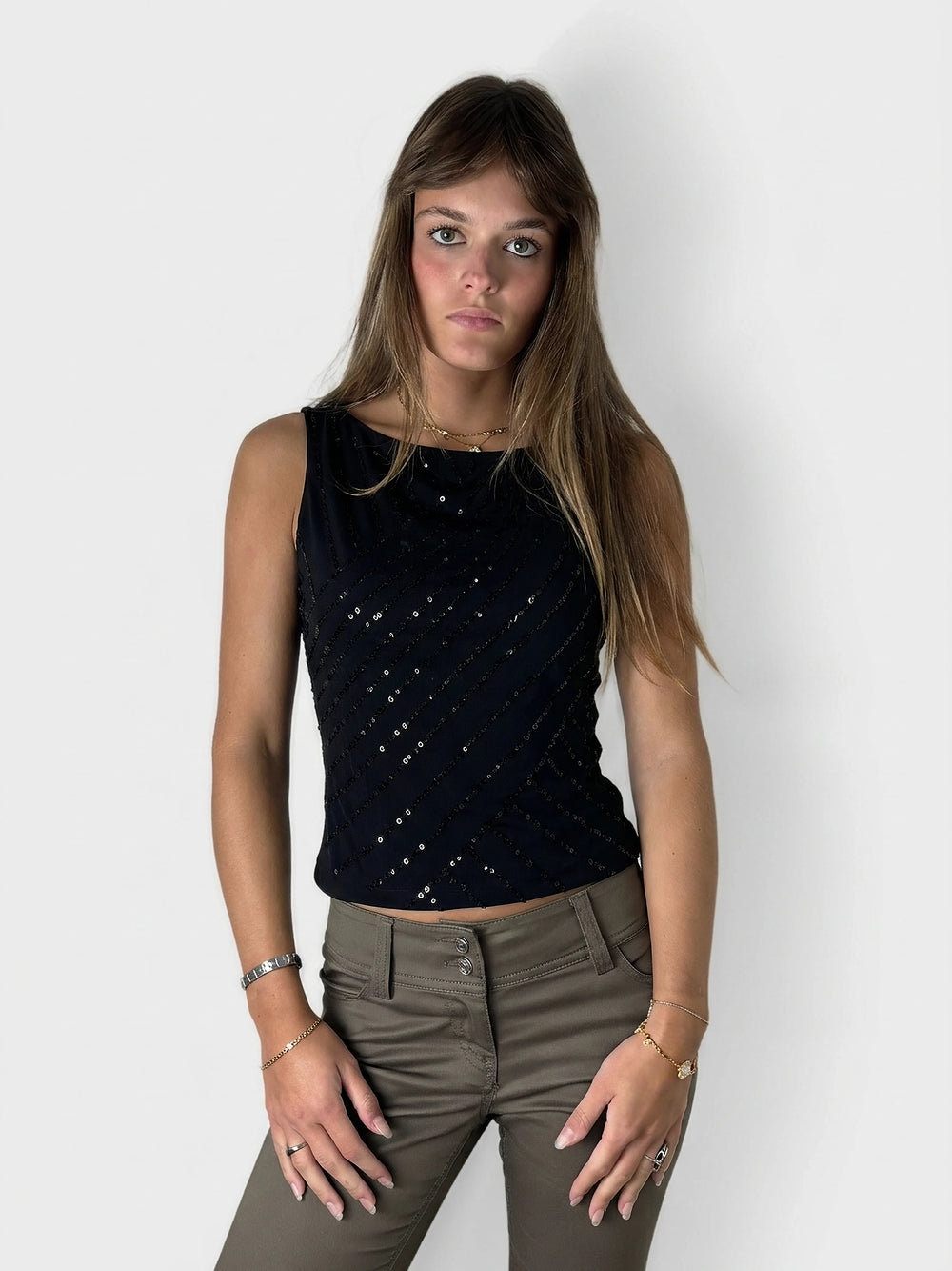 Navy sequin tank top with asymmetrical hem, front view, featuring diagonal sequined stripes.