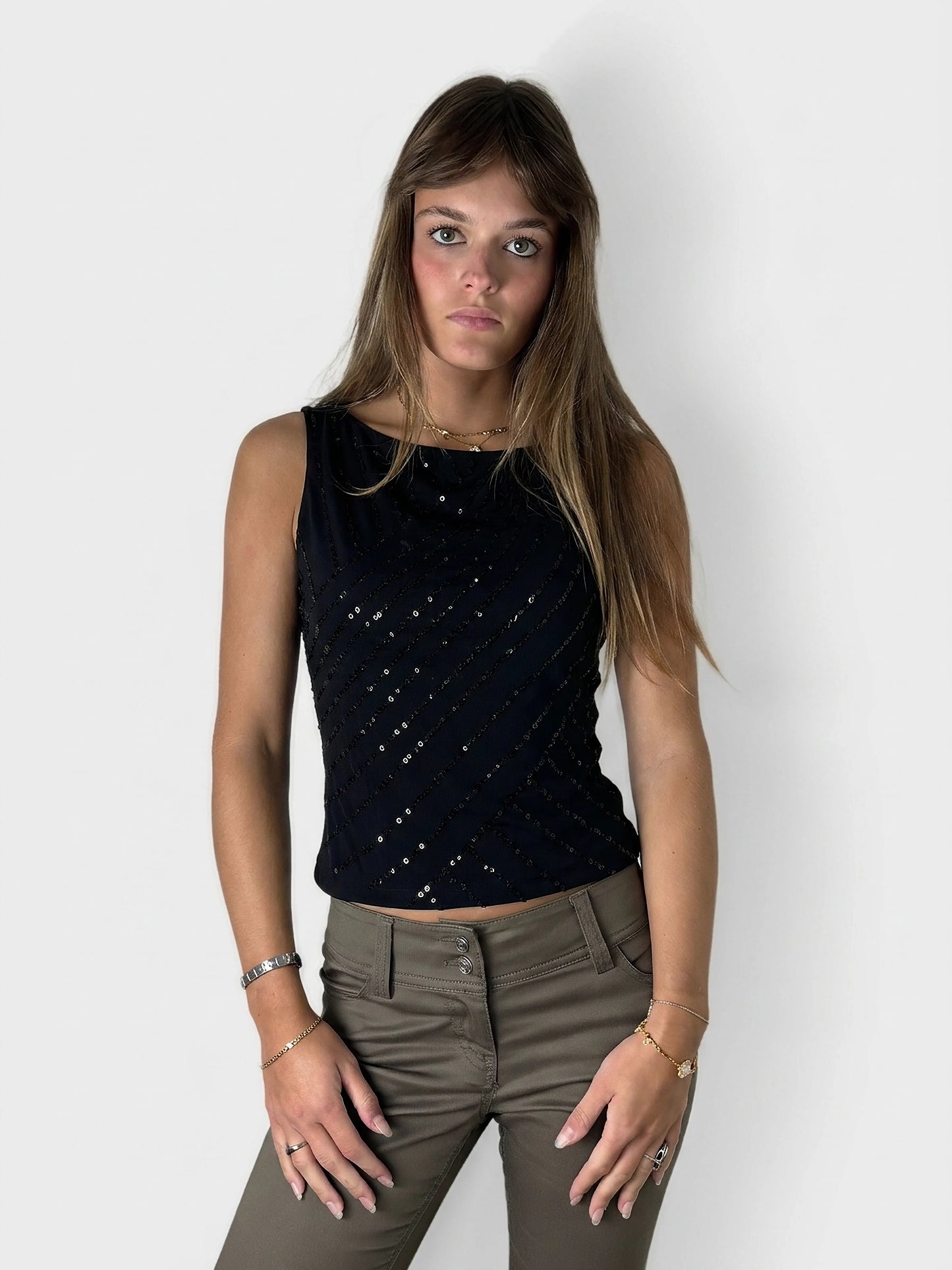 Navy sequin tank top with asymmetrical hem, front view, featuring diagonal sequined stripes.