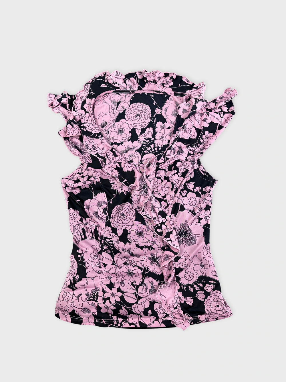 Pink floral vintage corset dress in a front view with ruffled trim.
