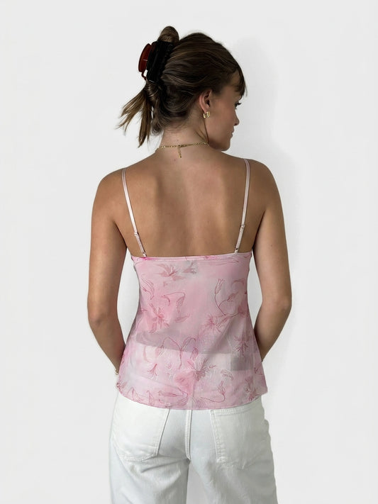 Back view of a pink sheer floral top with thin straps.
