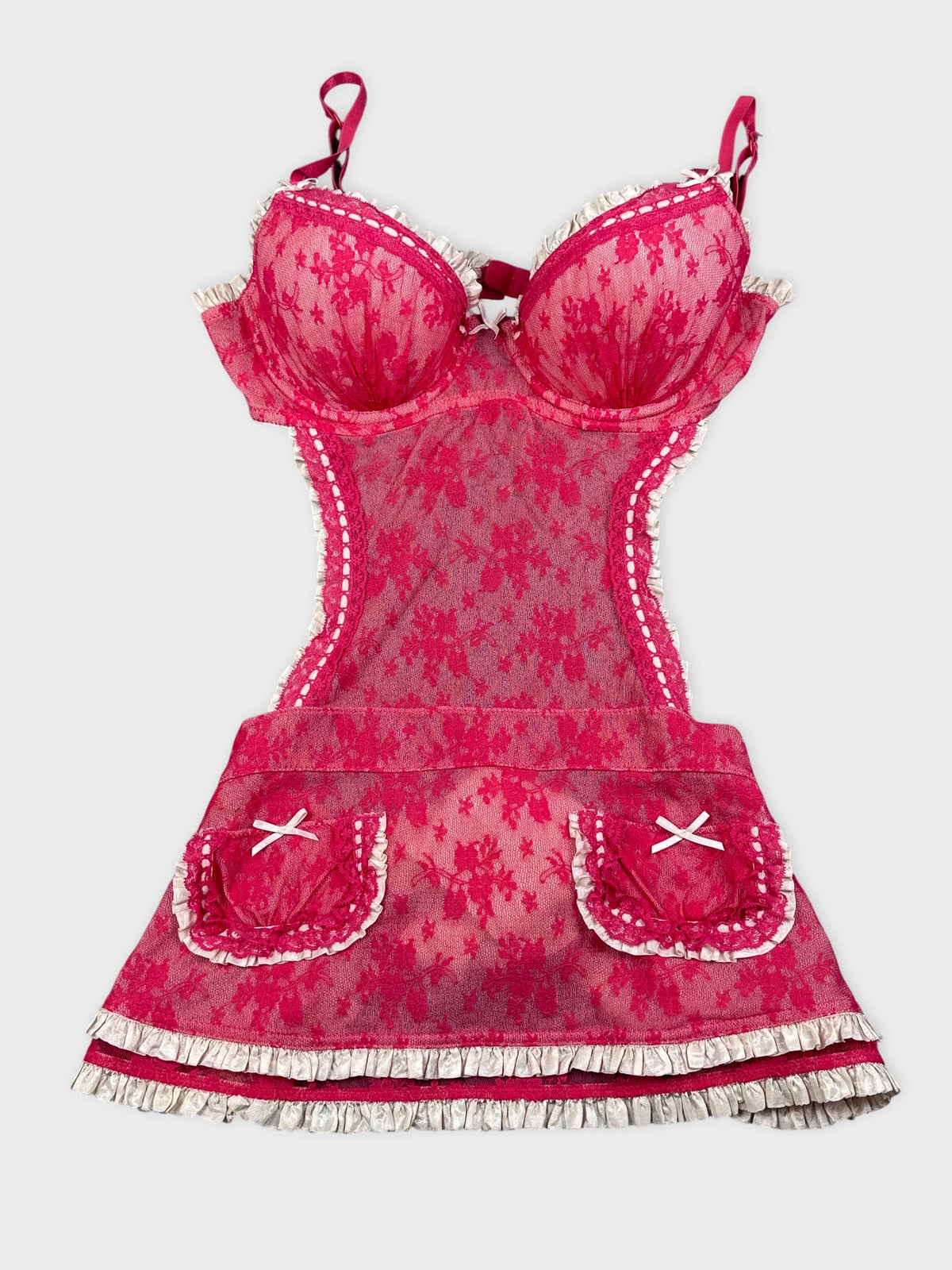 Front view of a pink vintage dress with lace trim and floral pattern.