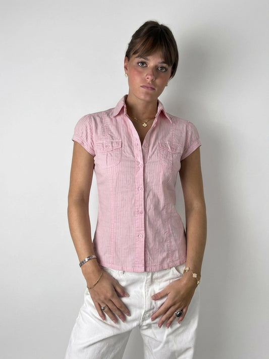 Front view of a pink short sleeve shirt with a pinstriped pattern.
