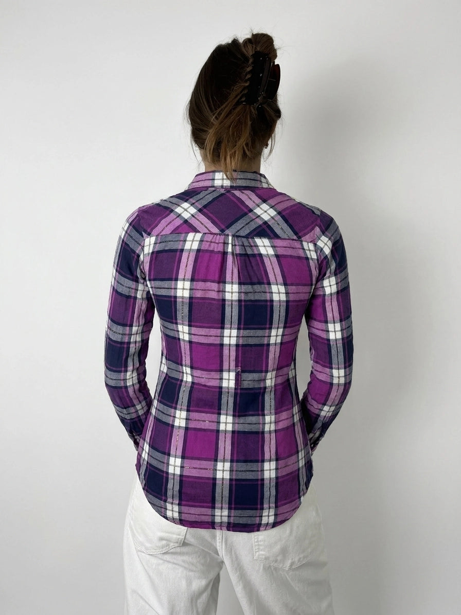 Back view of plaid button-up shirt in purple with unique cutout detail.