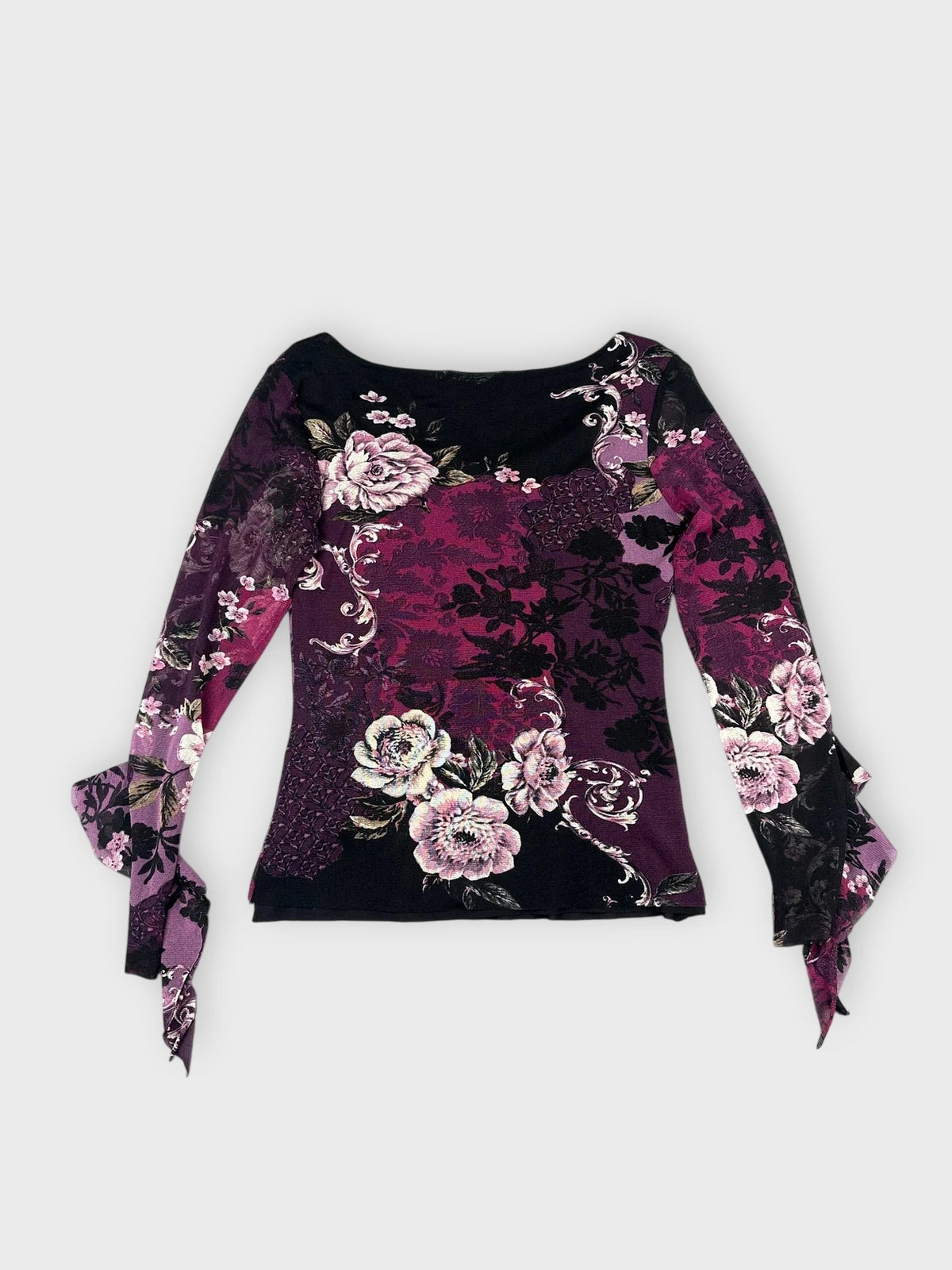 Back view of a purple floral lace top with bell sleeves.