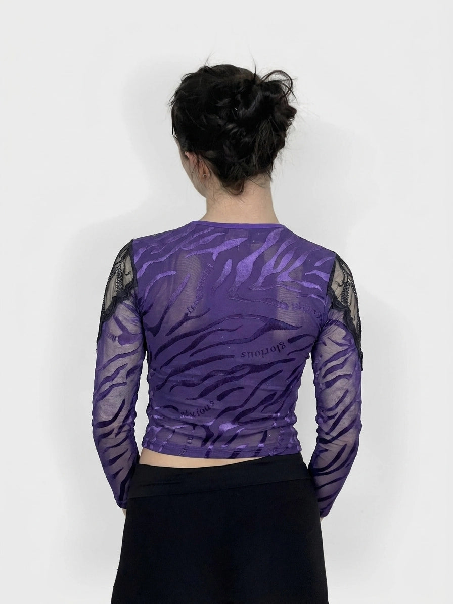 Back view of a purple long sleeve top with ruched design and lace sleeves.