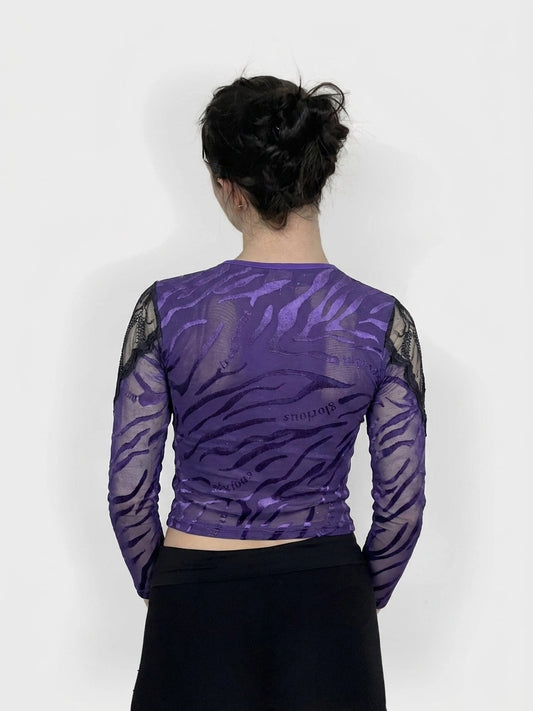 Back view of a purple long sleeve top with ruched design and lace sleeves.