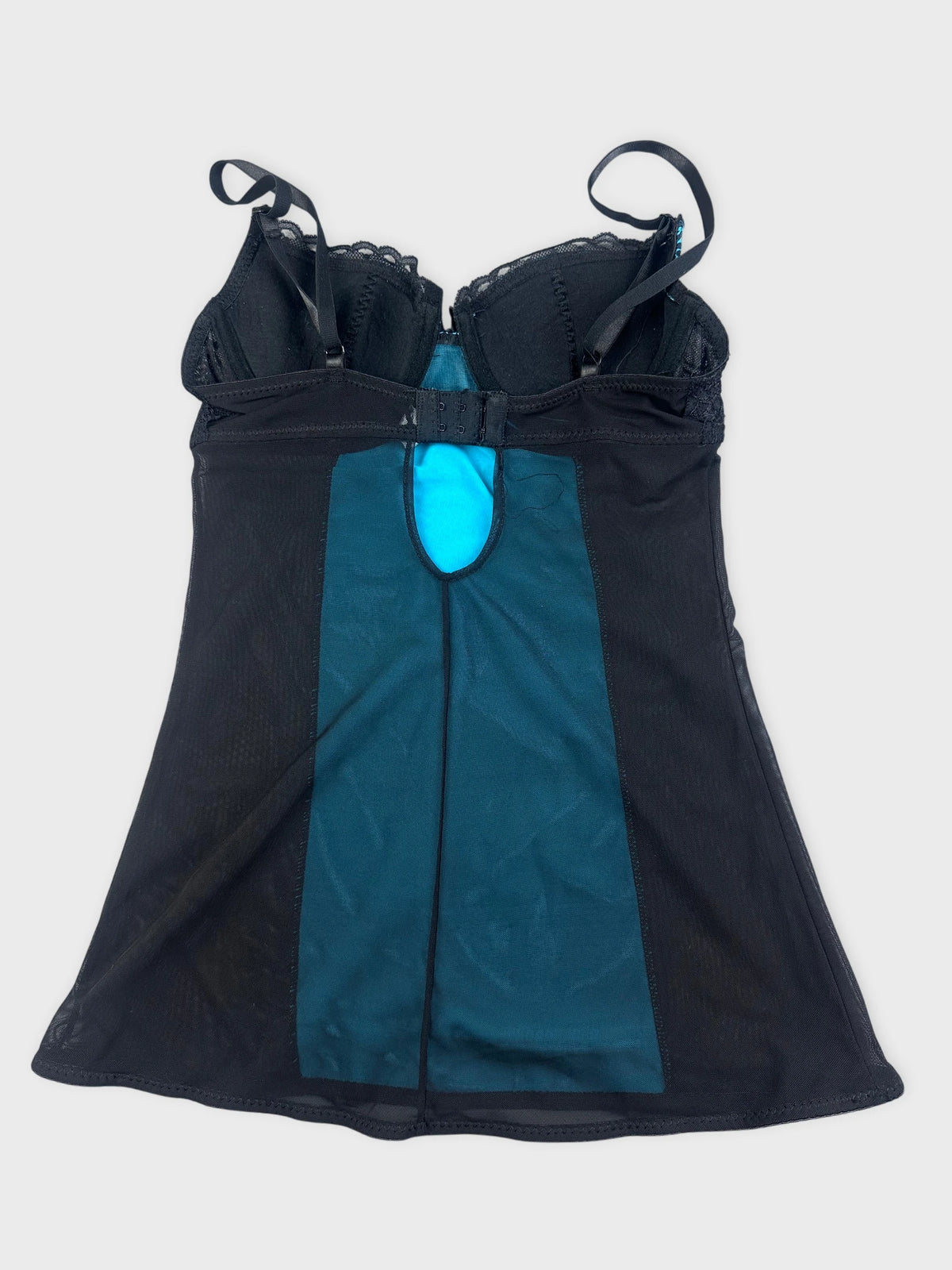 Back view of a black animal print tank with turquoise detail.