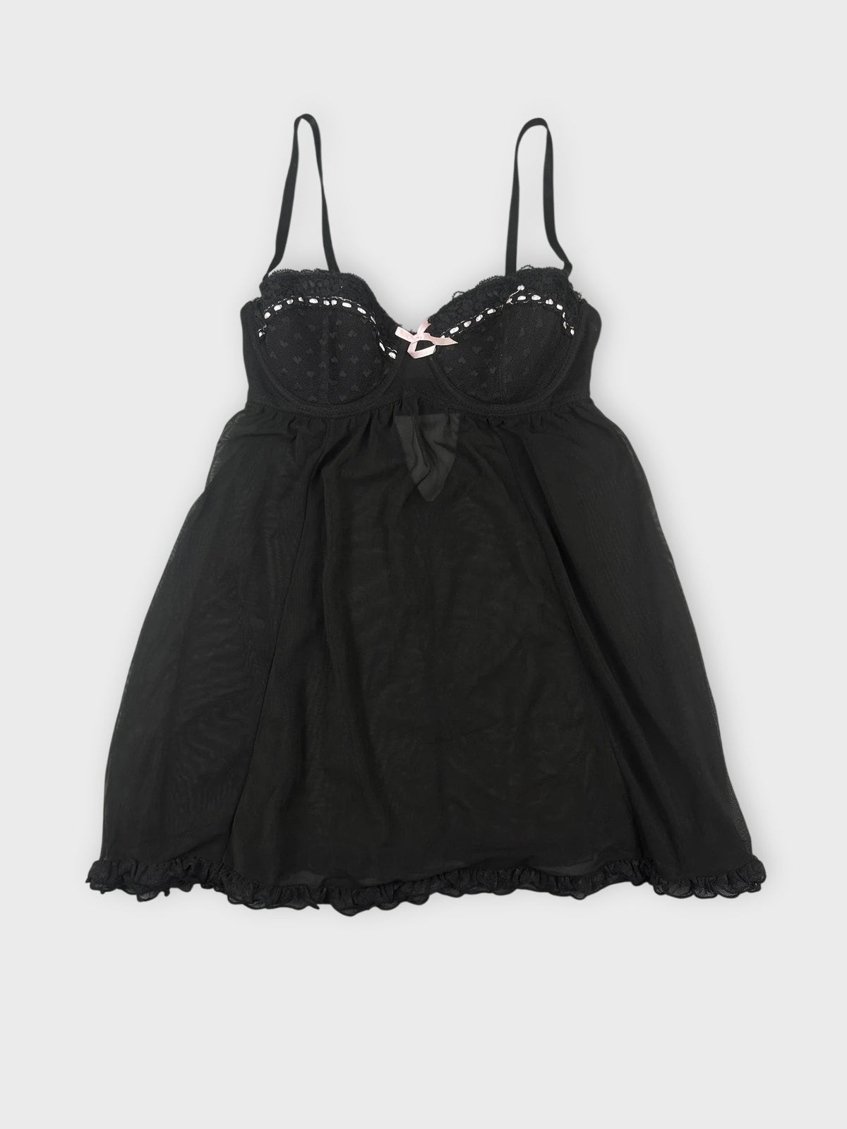 Sheer black babydoll top with pink trim front view.