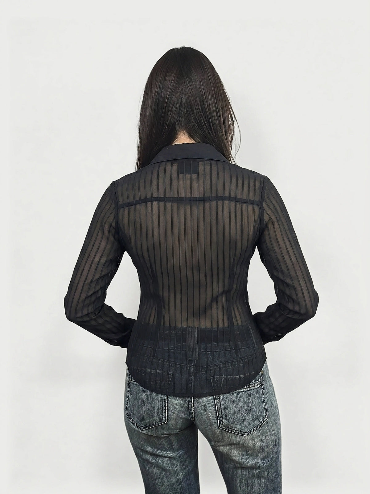 Back view of sheer black body shirt with pinstripes and collar.
