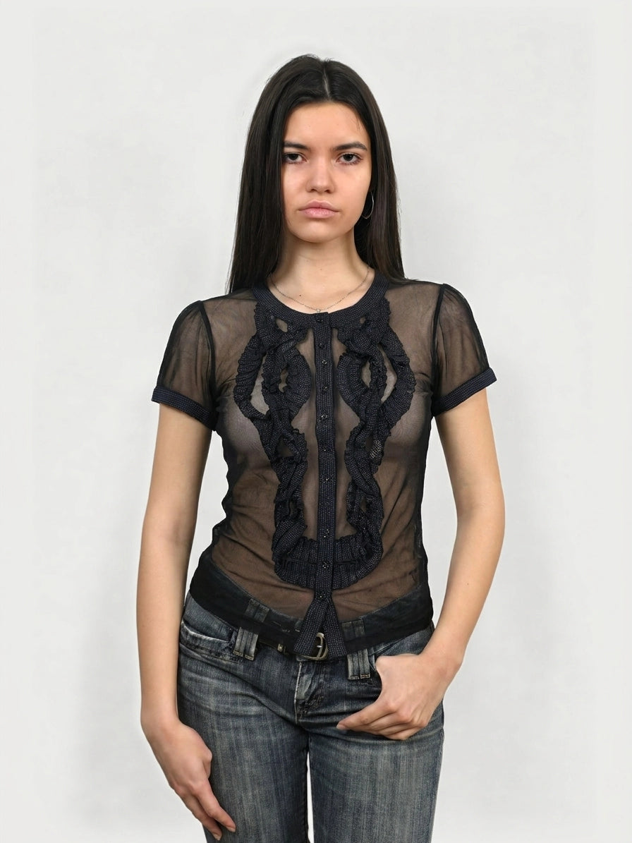 Front view of sheer black button-up top with ruffle detail.