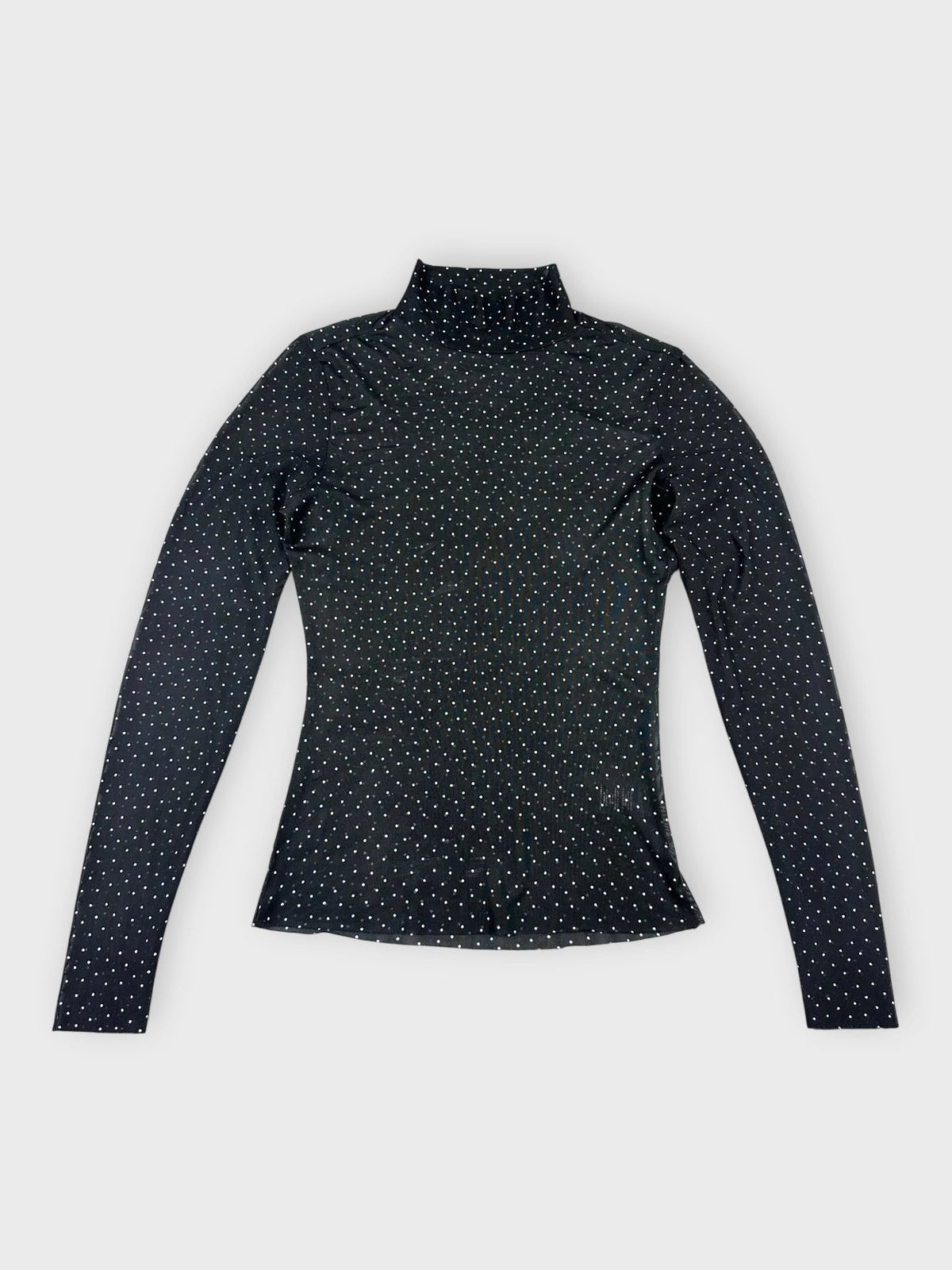 Sheer black long sleeve top with polka dots front view.