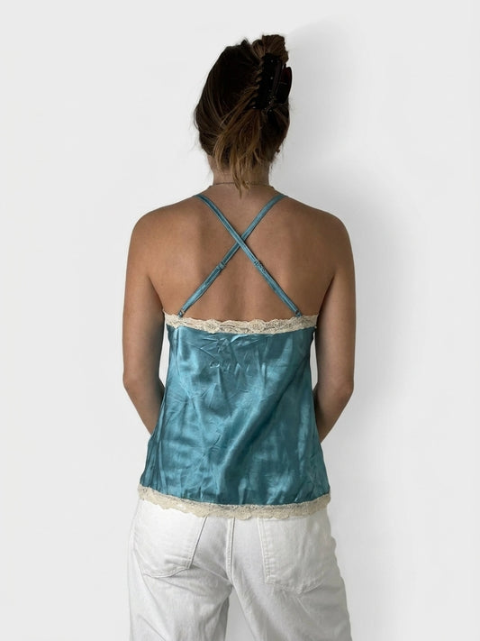 Back view of a blue silk camisole with lace trim.