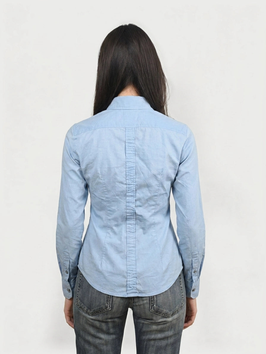 Back view of a sky blue button-up shirt featuring a clean collar and tailored fit.