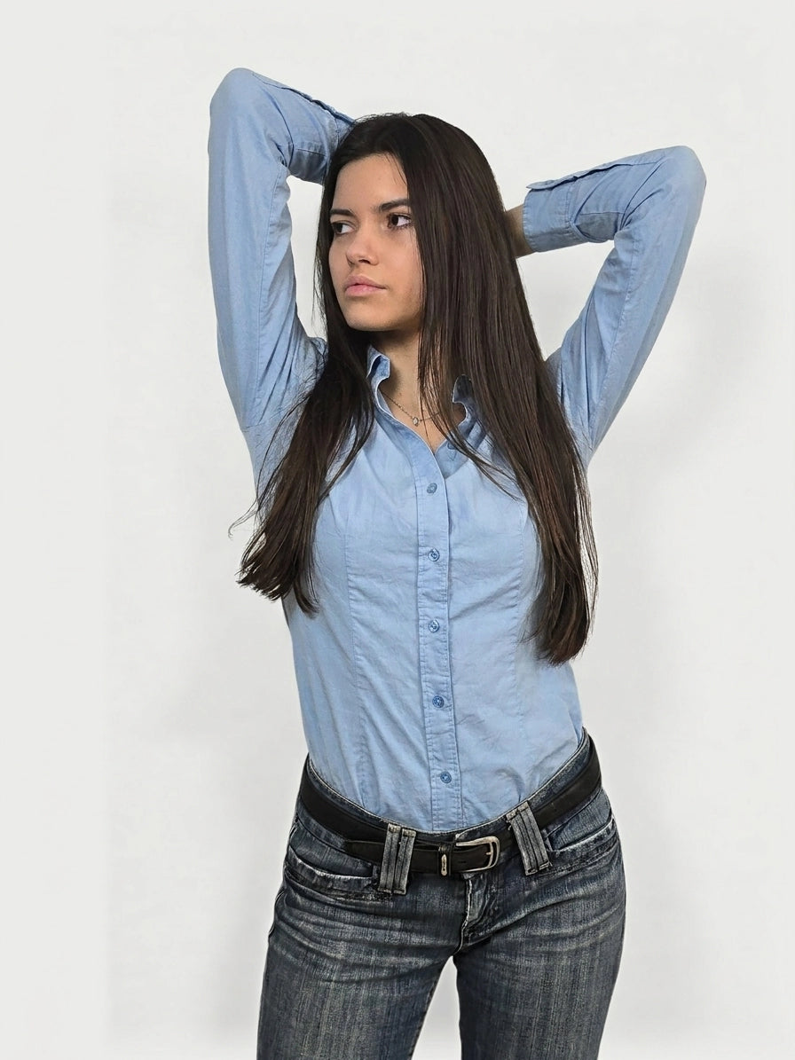 Sky blue button-up shirt with a button front detail, front view.
