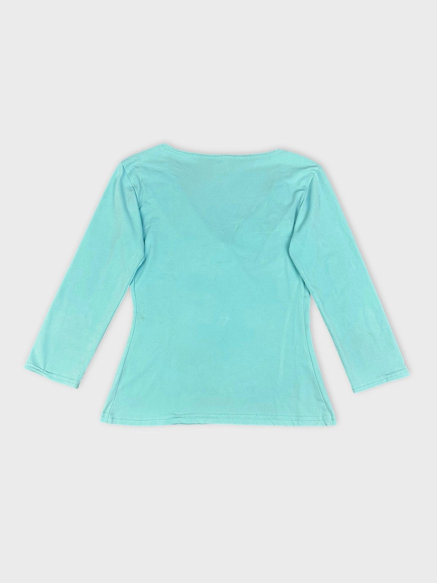 Sky blue long sleeve top back view with casual shape and smooth texture.