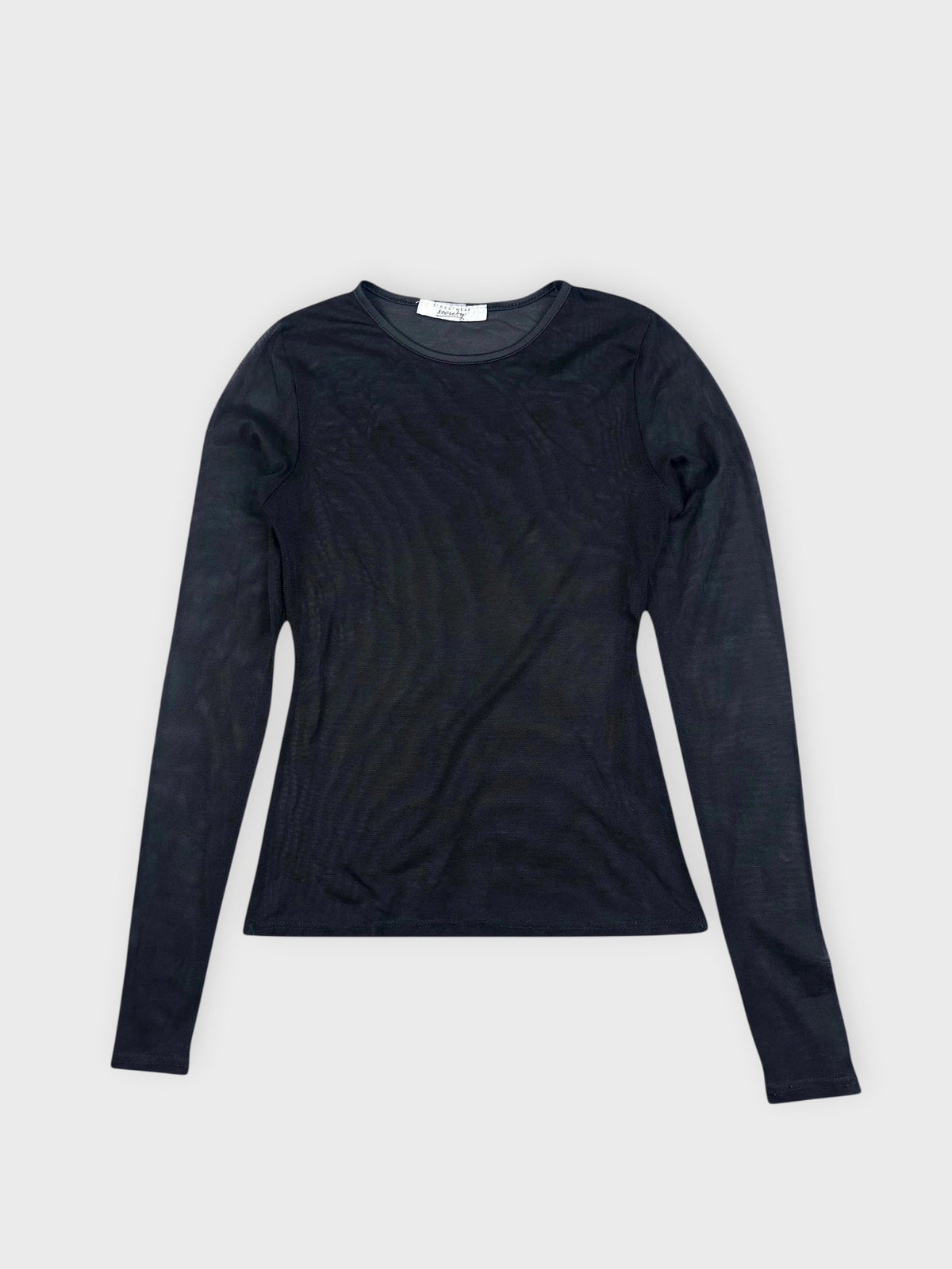 Sleek sheer black long-sleeve top detail view highlighting its transparent texture.