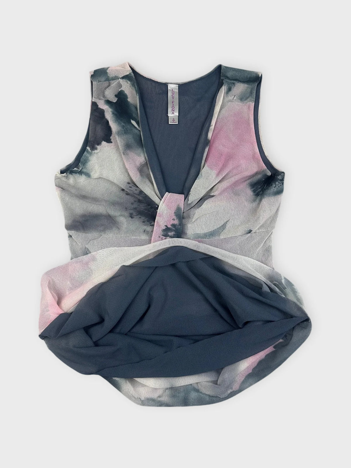 Detail view of sleeveless floral top in gray with pink watercolor pattern.
