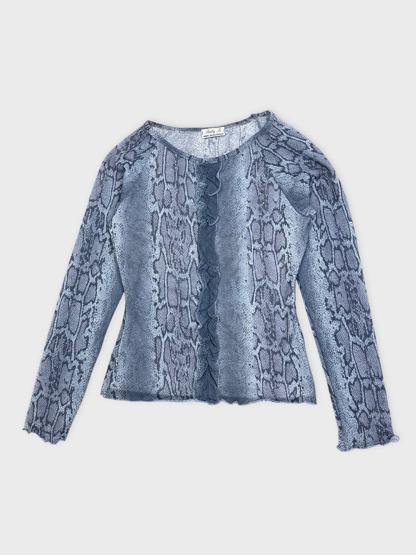 Detail view of a snake print long-sleeve top in blue